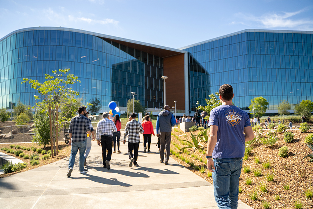 photo of people walking up to building