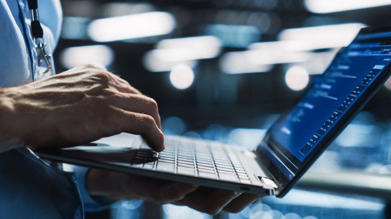 illustration of person holding laptop and scrolling